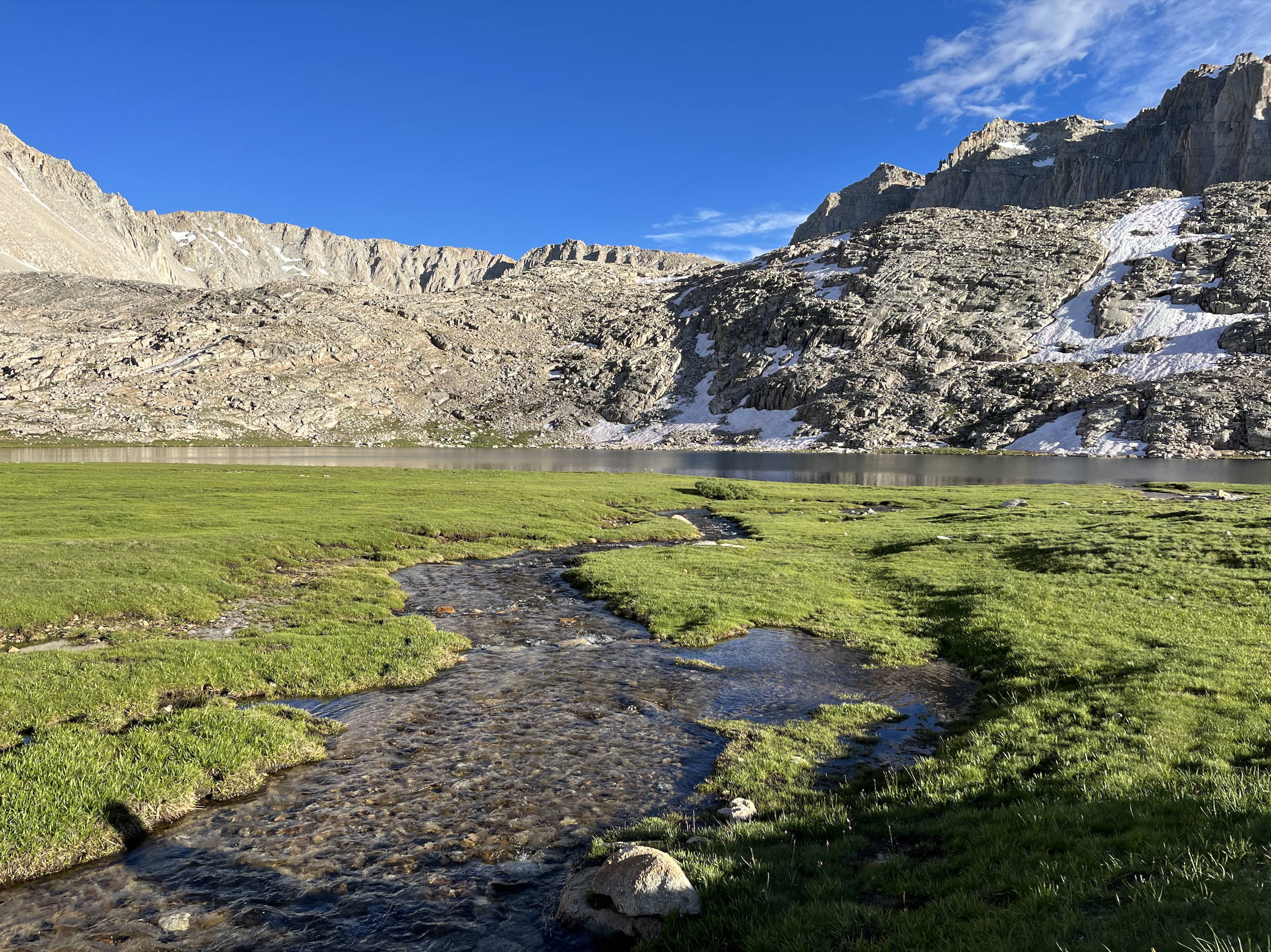 A small creek flows into Guitar Lake, a small alpine lake sitting below Mount Whitney.