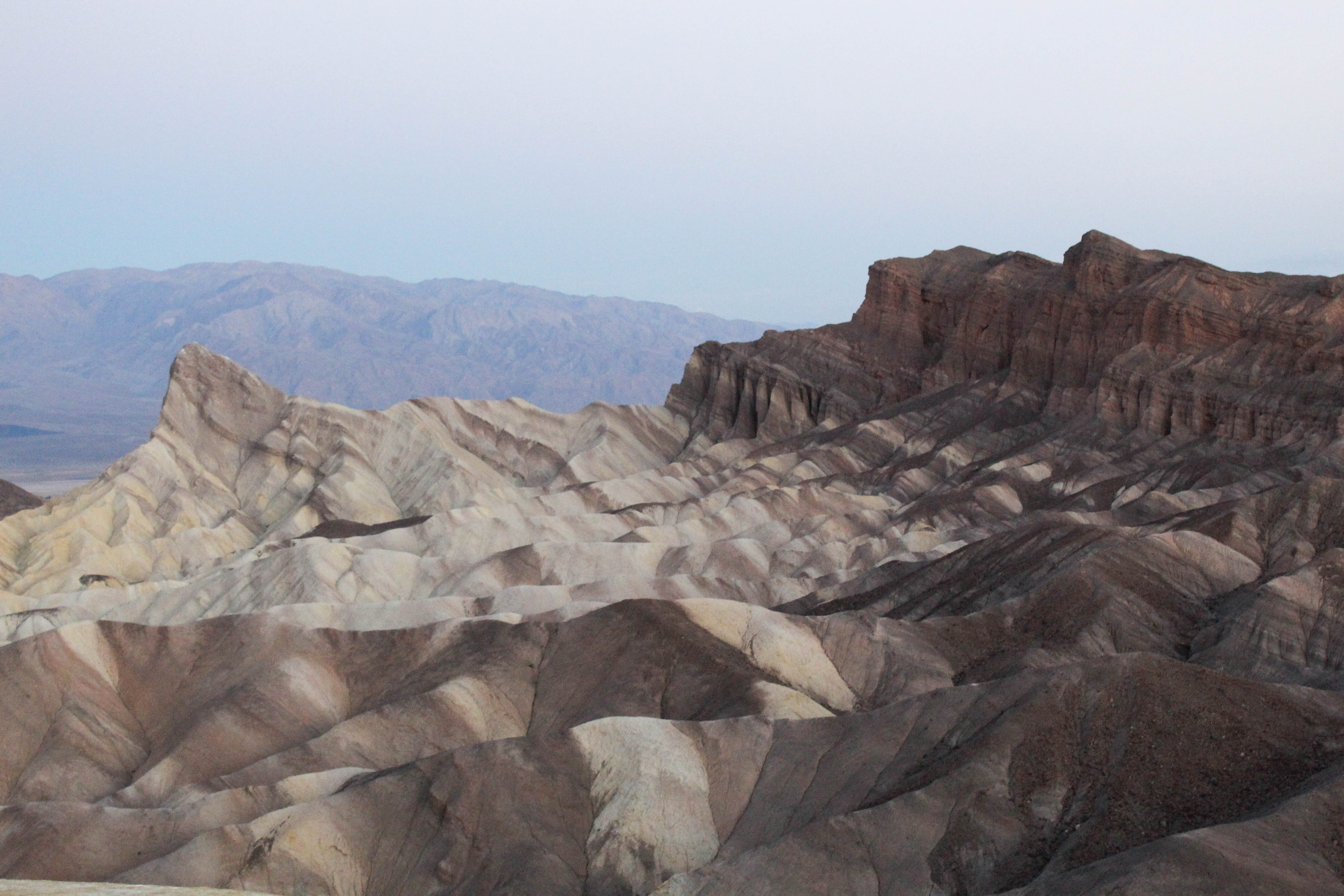 A landscape image of brown and tan plateaus in Death Valley.