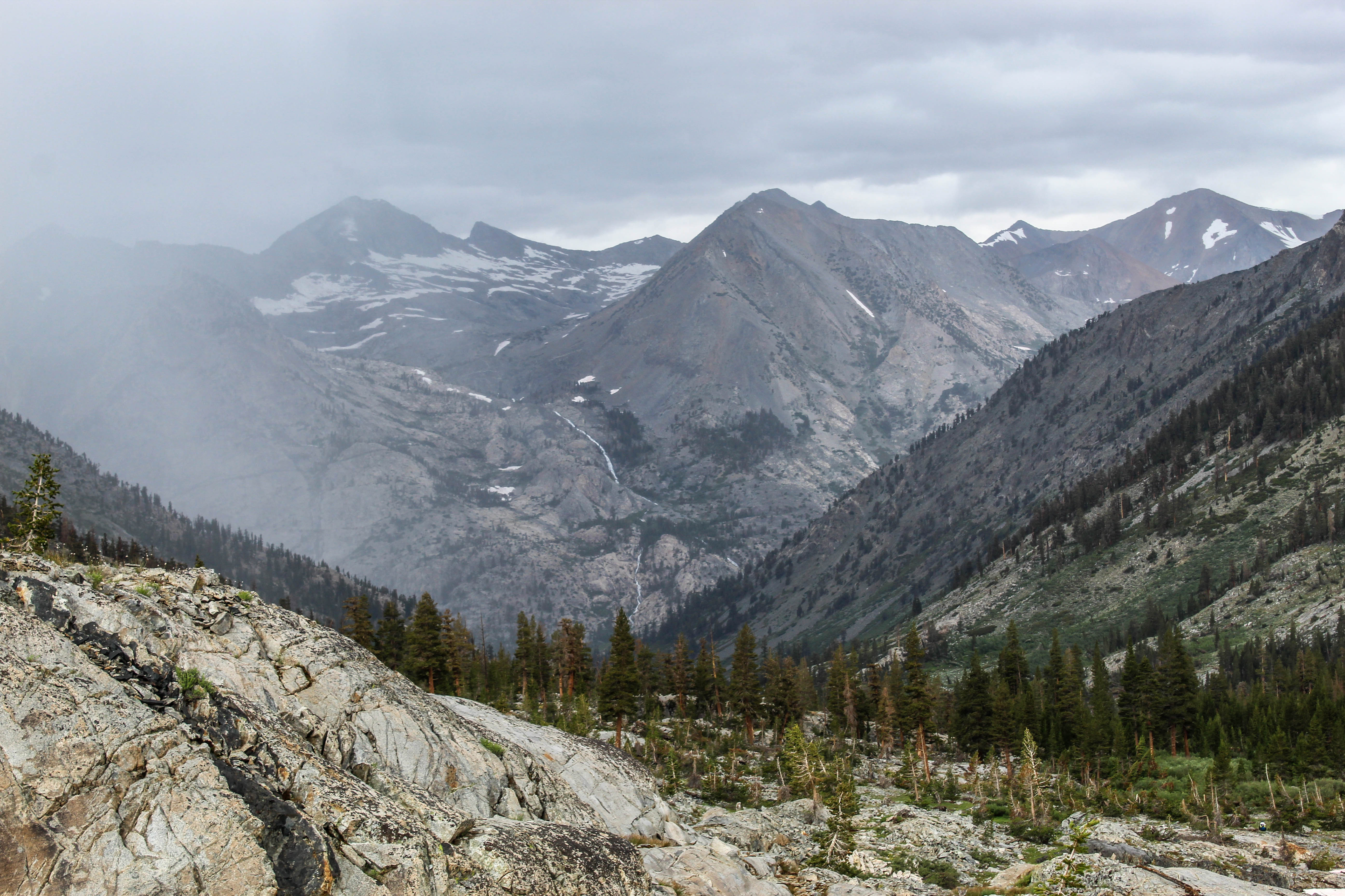 Dark skies over a rocky mountain pass.