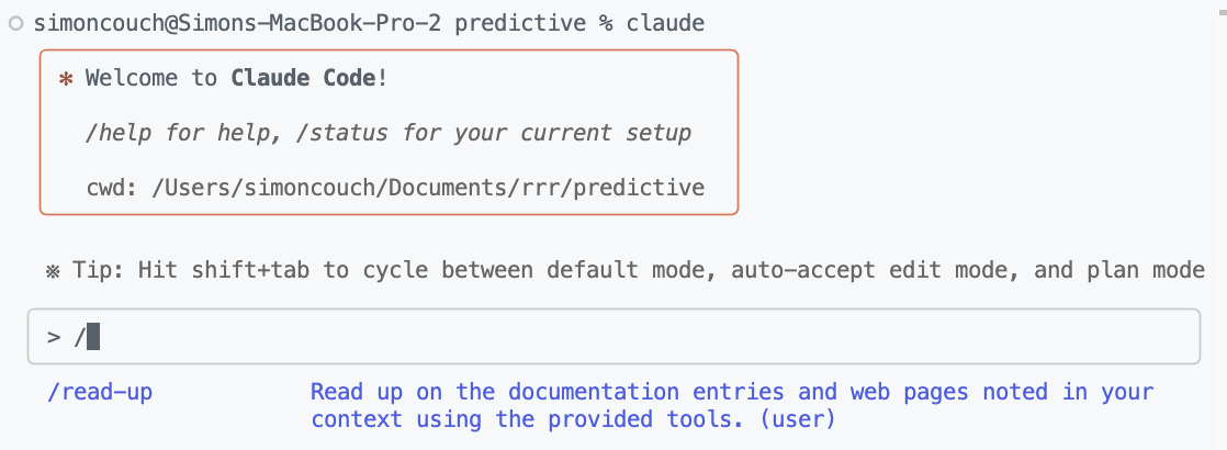 A screenshot of a Claude Code terminal. In the user submission box, I've typed '/', and the suggestion immediately below reflects the `read-up` command I just added.